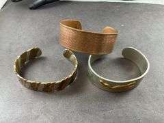 Three Cuff Bracelets One of Copper, One Copper And Silvertone, One Heavy Silver Tone