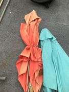 Two Patio Umbrellas With Fabric Damage