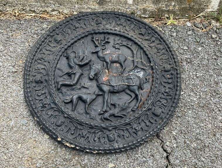 Iron Plaque with Raised Figural and Decorative Motifs, 13-Inch Diameter