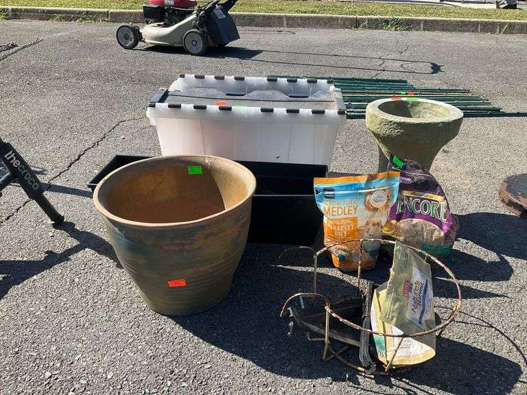 Gardening Items Including Clay and Plastic Planters, Cement Stand, Birdseed, and Wire Holder