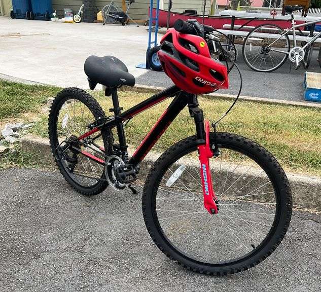 Nishiki Pueblo 24-Inch Youth Mountain Bike with Red Helmet