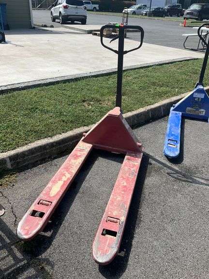 Red CFE Manual Pallet Jack with Two Forks and Black Handle
