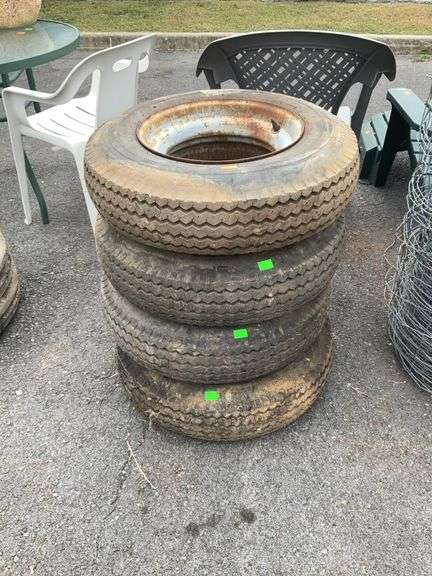 Set of 4-Trailer tires on the Donut style ring wheels, 7-14.5 tires.