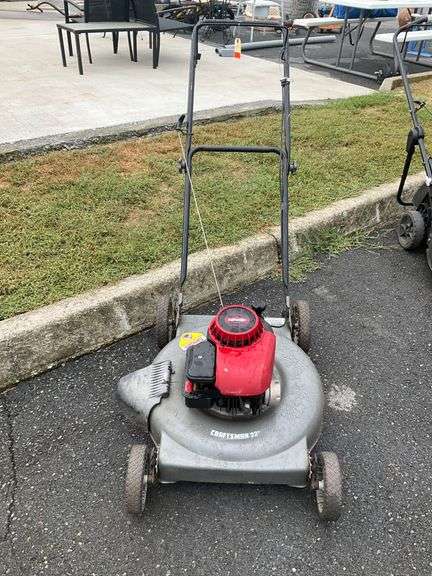 Craftsman 22-Inch Gas Lawn Mower with Briggs & Stratton Engine, Machine is in operating condition.