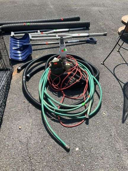 Water submersible Pump with hoses and electric cord, operating condition unknown to Hash Auctions