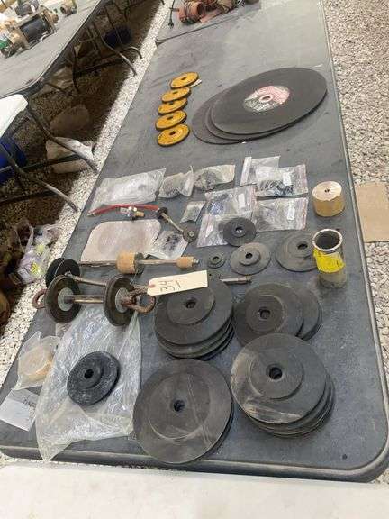 Tbl lot: 3 Hobo 14” portable saw discs, 5 Dewalt DW454 4-1/2” grinding wheels, rubber grommets, etc.