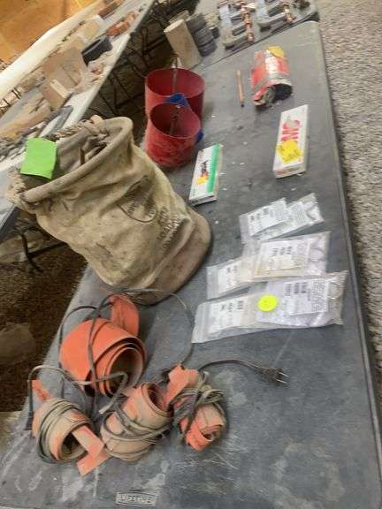 Klein Tool bag: pipe heater straps:. Larson riveter, DMC wire stripper, Arcair copper electrodes, et