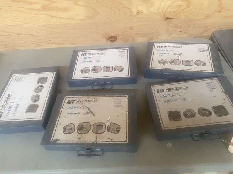 Five metal cases containing hose tech, USA, plugs and caps-see photos