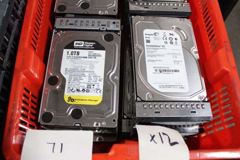 LOT OF ASSORTED 3.5 IN SIZE HARD DRIVES INCLUDING WESTERN DIGITAL 1 TB CAPACITY SATA HARD DRIVE MODEL NO WD1003FBVX-01Y780 AND SEAGATE 1 TB CAPACITY SATA HARD DRIVE MODEL NO ST1000NM011