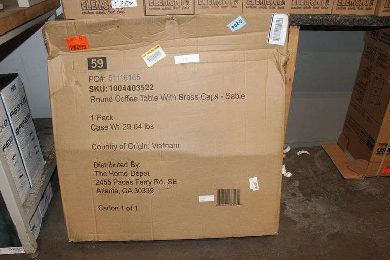HOME DEPOT ROUND COFFEE TABLE WITH BRASS CAPS SABLE 1004403522