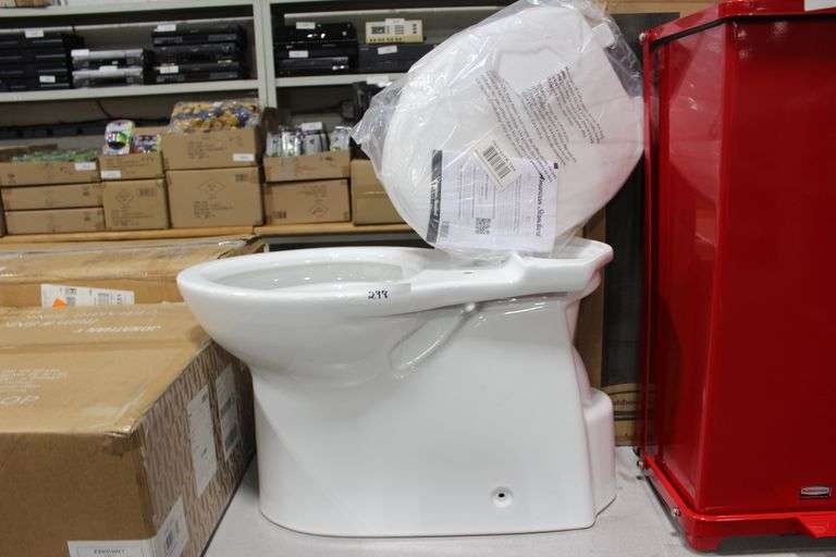 Brand new American Standard toilet unboxed, comes with all of the toilet seat, toilet seat covers and various other accessories