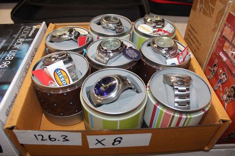 Assorted Fossil Collegiate Licensed Watches featuring teams such as Michigan and various others