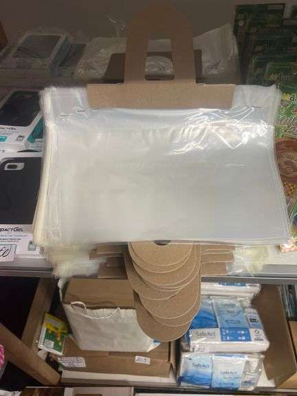 CLEAR PLASTIC TEAR-AWAY BAGS APROX 12"x6" WITH 50+ PER HANDLE