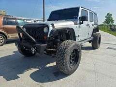2010 JEEP WRANGLER VIN# 1J4BA5H18AL105895 HAS KEY HAS REBUILT TITLE 5SPEED 4X4 CUSTOM WHEELS WITH 90