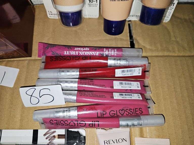 VARIOUS COLOR LIP GLOSSES RETAILING $9.50 EACH