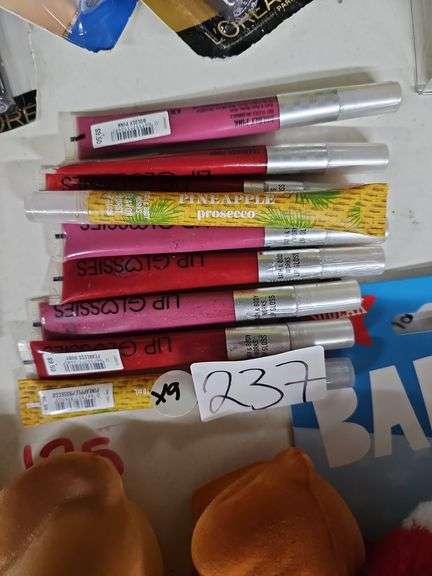 VARIOUS COLOR LIP GLOSSES RETAILING $9.50 EACH