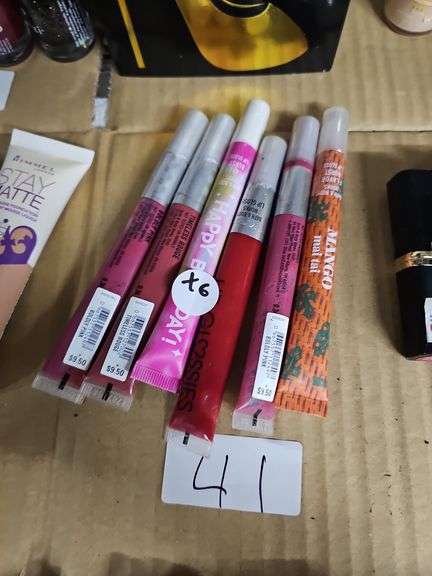 VARIOUS COLOR LIP GLOSSES RETAILING $9.50 EACH