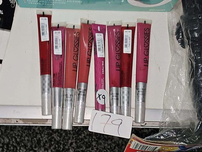 VARIOUS COLOR LIP GLOSSES RETAILING $9.50 EACH