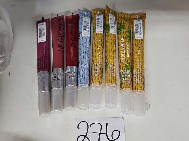 VARIOUS COLOR LIP GLOSSES RETAILING $9.50 EACH
