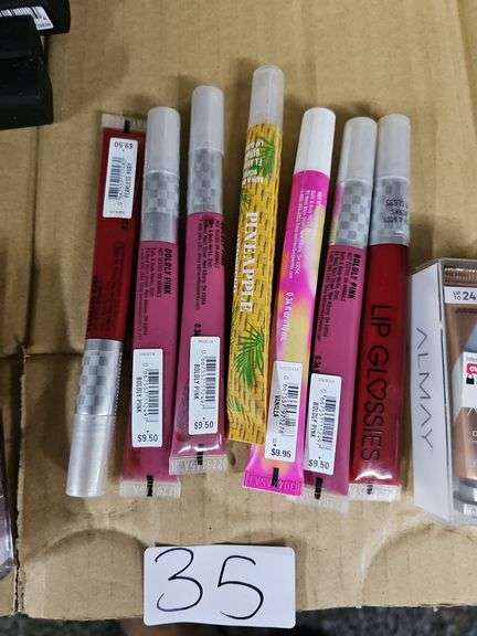 VARIOUS COLOR LIP GLOSSES RETAILING $9.50 EACH