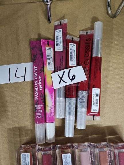 VARIOUS COLOR LIP GLOSSES RETAILING $9.50 EACH
