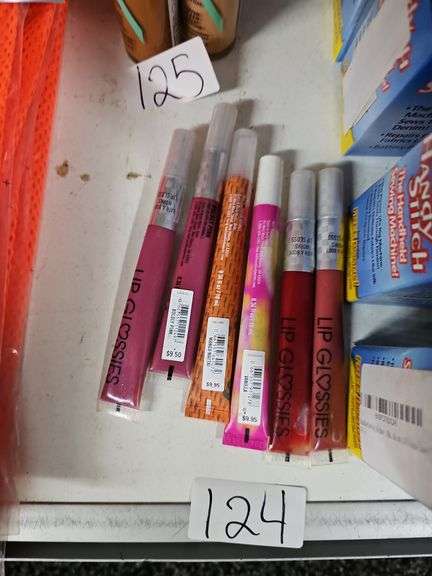 VARIOUS COLOR LIP GLOSSES RETAILING $9.50 EACH