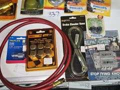 AUTOMOTIVE REPLACEMENT PARTS AND HARDWARE ALL NEW INCLUDING PHILIPS HEADLIGHT BULBS, 18" REINFORCED GREASE HOSE, SELF LOCKING TIE-DOWN SYSTEM ECT