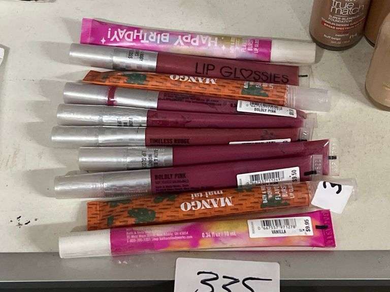 VARIOUS COLOR LIP GLOSSES RETAILING $9.50 EACH
