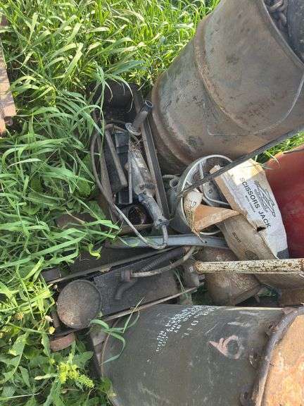 Pallet with miscellaneous barrels, floor jack, iron