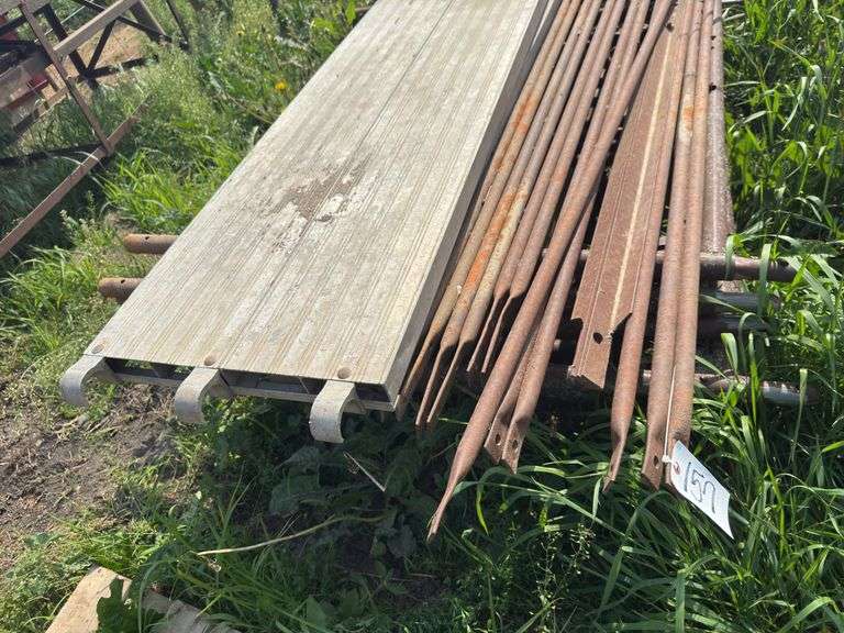 Pallet with scaffolding. 5ft wide, 4ft tall. 7 uprights, 2 planks