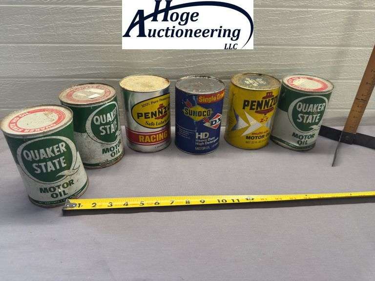 6 one quart oil cans. 3 Quaker State, 2 Pennzoil, 1 Sunoco