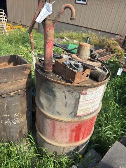 Pallet with miscellaneous barrels, floor jack, iron