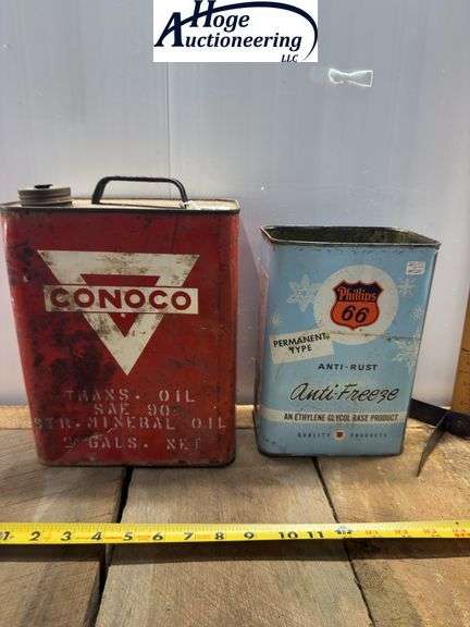 2 cans. Conoco Mineral Oil can (2 gallons), Phillips 66 Anti-Freeze can (1 gallon)