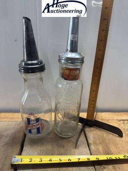 2 one quart glass oil bottles.1 embossed Standard Oil Company Service (Indiana), 1 Huffman Mfg Compa