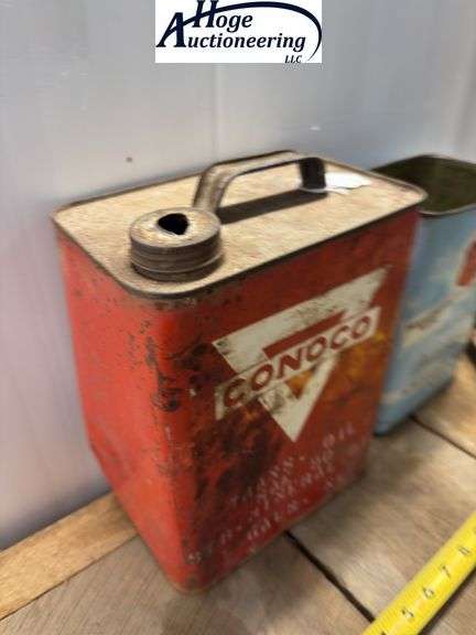 2 cans. Conoco Mineral Oil can (2 gallons), Phillips 66 Anti-Freeze can (1 gallon)