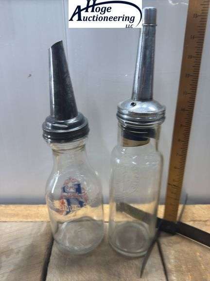 2 one quart glass oil bottles.1 embossed Standard Oil Company Service (Indiana), 1 Huffman Mfg Compa