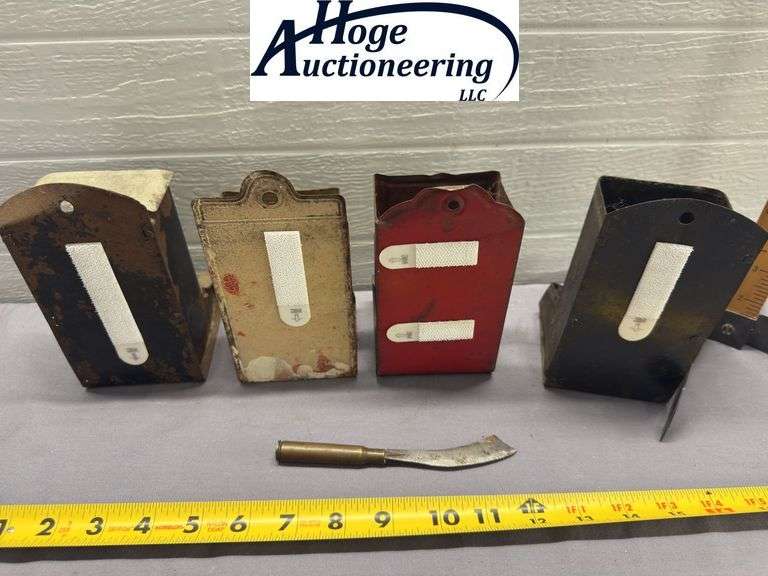 4 tin hanging matchboxes and homemade tool. 1 Zephyr Flour, 1 Fred Karle Furniture and Undertaking K