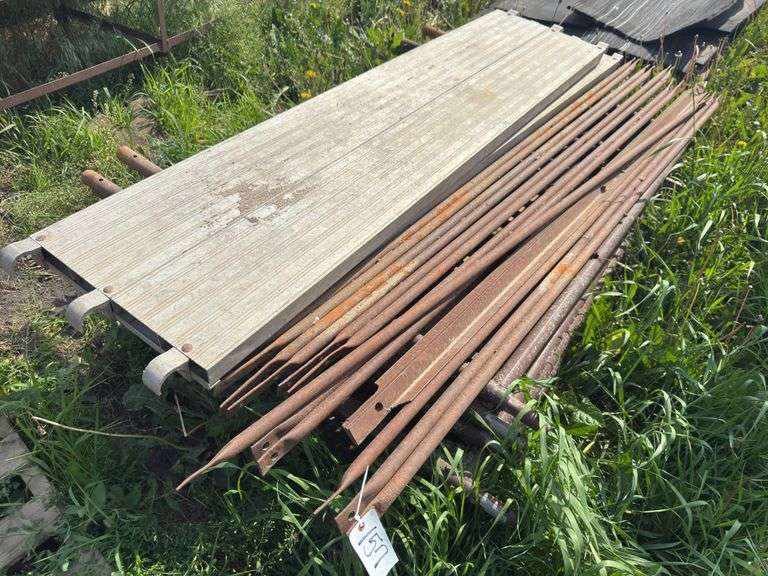 Pallet with scaffolding. 5ft wide, 4ft tall. 7 uprights, 2 planks