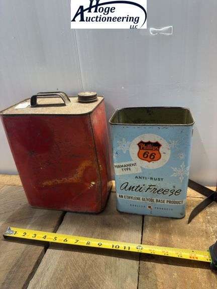 2 cans. Conoco Mineral Oil can (2 gallons), Phillips 66 Anti-Freeze can (1 gallon)