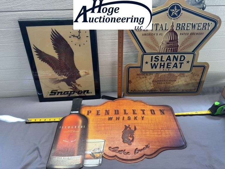 3 items. 1 Snap-on John E. Bradley eagle clock, 1 Pendleton Whisky sign, 1 Capital Brewery sign.