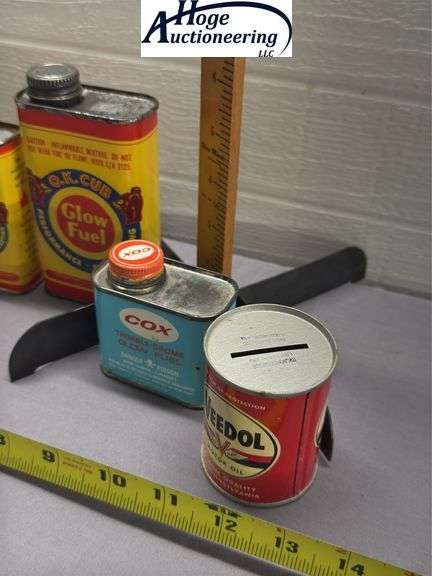 6 cans. Glow fuel and oil. 1 Veedol bank, 1 Structo bank, 1 Wolf's head bank, 1 Cox, 2 O.K. Cub