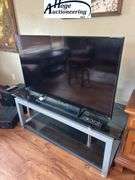 Sony flatscreen TV and TV stand. Remote included