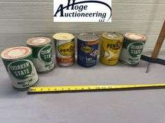 6 one quart oil cans. 3 Quaker State, 2 Pennzoil, 1 Sunoco