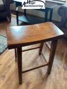 Wooden saddle bar stool