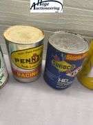 6 one quart oil cans. 3 Quaker State, 2 Pennzoil, 1 Sunoco