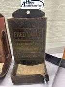 4 tin hanging matchboxes and homemade tool. 1 Zephyr Flour, 1 Fred Karle Furniture and Undertaking K