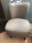 Grey cloth curved back chair