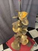 Brass props on roller display
