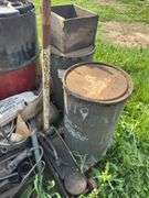 Pallet with miscellaneous barrels, floor jack, iron