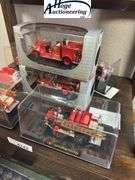 Bottom Shelf - model fire trucks in display boxes, Texaco fire helmet. (trucks include Ford, Packard